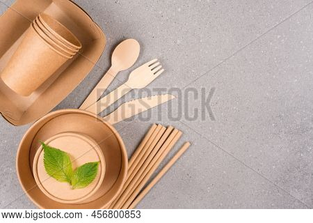 Eco Paper Utensils - Paper Plates And Cups, Food Containers, Drinking Straws And Wooden Cutlery Over