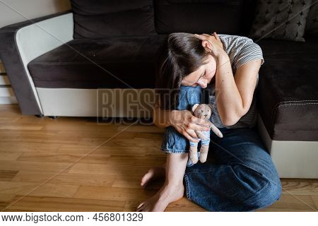 Perinatal Loss Reproductive Chalenge Concept - Female Holding A Teddy Bear Toy