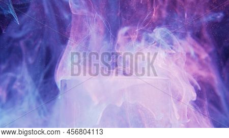 Iridescent Glow Background. Neon Glitter Fluid. Dreamlike Illusion. Fluorescent Pink Purple Blue Col