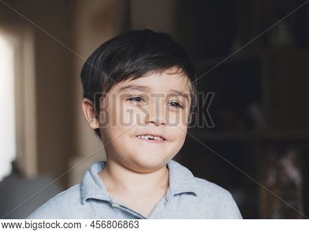 Cinematic Portrait Kid Looking Deep In Thought, Dramatic Happy Young Boy Looking Out With Smiling Fa