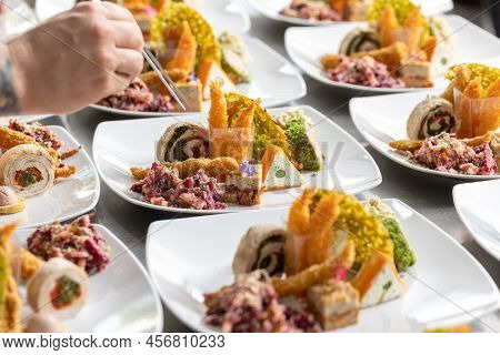 Chef Adding The Final Touch To The Starter Dish
