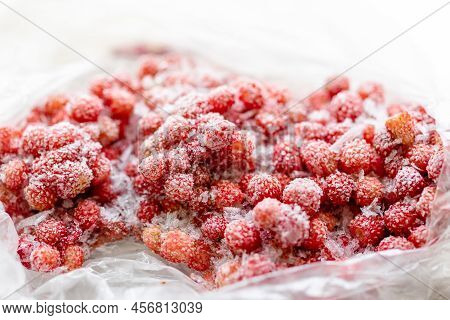 Lot Of Frozen Red Wild Forest Strawberry In Reusable Cellophane Bag For Storage. Selective Focus.