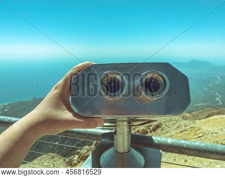 A Viewing Platform With Binoculars With Large Black Lenses Against The Sky. Environment Magnifier. P