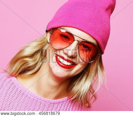 Stylish Fashion Portrait Of Trendy Casual Young Woman In Pink Pulover And Hat,