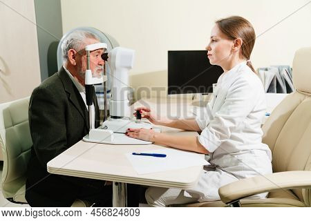 Ophthalmologist Examination Of Elderly Man On Corneo Topographer.modern Clinic