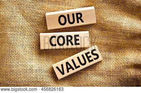 Our Core Values Symbol. Concept Words Our Core Values On Wooden Blocks On A Beautiful Canvas Table C