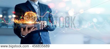 Businessman Using Tablet To Connected On Global Network And Gold Bitcoin Coin In Fire And Growth Of 