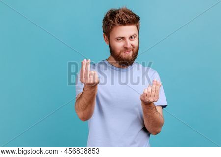 Portrait Of Cunning Mercantile Bearded Man Rubbing Fingers Showing Money Gesture, Asking For Salary,