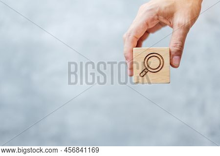 Hand Hold Magnifying Glass Block. Seo, Search Engine Optimization, Advertising, Idea, Strategy, Mark