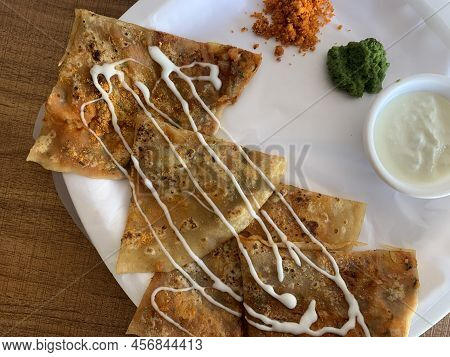 Aloo Paratha Or Indian Potato Stuffed Flatbread. Served With Fresh Curd And Chutneys. Selective Focu