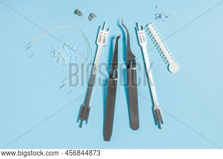 A Set Of Special Tools For An Orthodontist To Install Braces For A Patient. Orthodontic Arcs, Ligatu