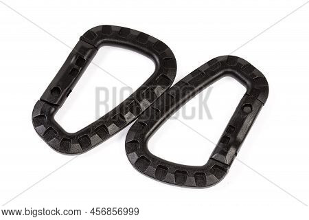Two Small Black Strong Plastic Non-locking Snap Hooks On A White Background