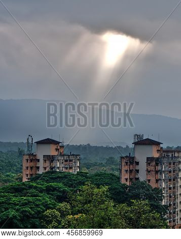 Sun Rays Falling On A Building Which Is Surrounded By Greenery In India