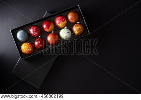 Open Gift Box With Assortment Of Homemade Chocolate Bonbons. Modern Hand Painted Chocolate Candy. Pr