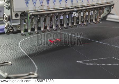 The Embroidery Machine Embroider Threads On Fabric In The Workshop