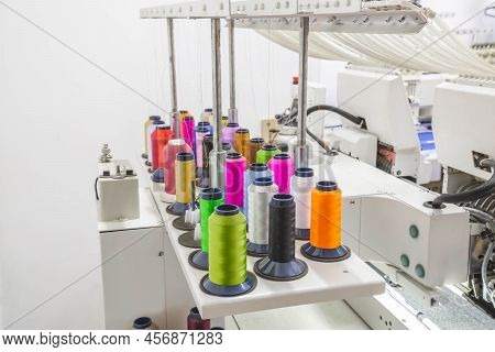 The Embroidery Machine In The Workshop Embroiders With Threads On Fabric