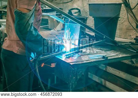 The Welder Works With Metal At The Factory