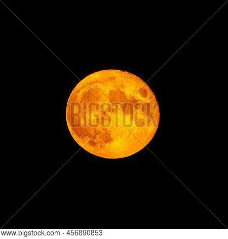 Bright Orange And Red Fool Moon Over The Sea. Red Full Moon In Red Color Also Called Bloodmoon