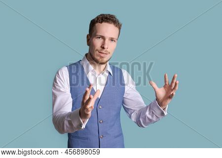 Portrait Handsome Business Man With Charming Smile, Gesturing With His Hands While Standing At Casua