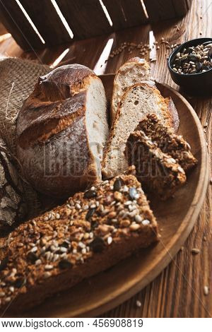 Different Kinds Of Bread With Whole Grain Products For A Healthy Nutrition Concept. Vertical Food Ph
