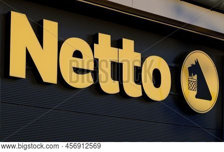 Poznan, Poland. 22 June 2022: Netto Sign On A Wall. Netto Is A Danish Discount Supermarket Operating