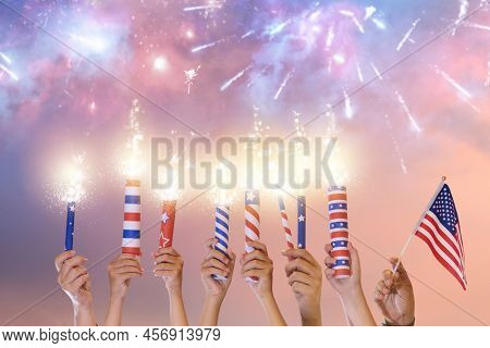 4th Of July In America. Usa Independence Day Fireworks. Hands Holding Firecrackers, Sparkler And Ame