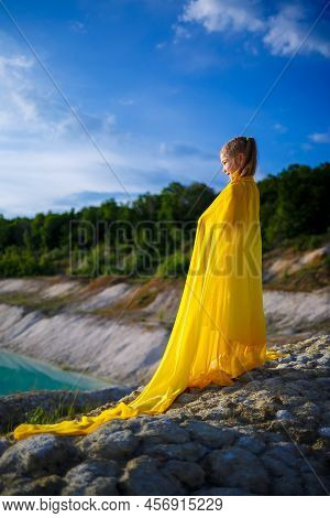 Ukrainian Patriot Girl In A Yellow Dress Against A Blue Sky. Summer Photo. Blue Sky. Sunny Day. Free
