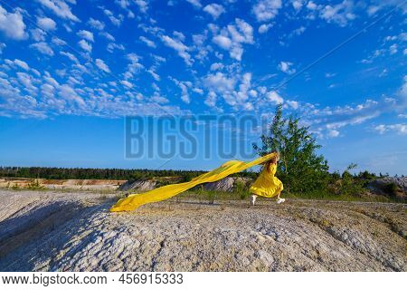 Ukrainian Patriot Girl In A Yellow Dress Against A Blue Sky. Summer Photo. Blue Sky. Sunny Day. Free