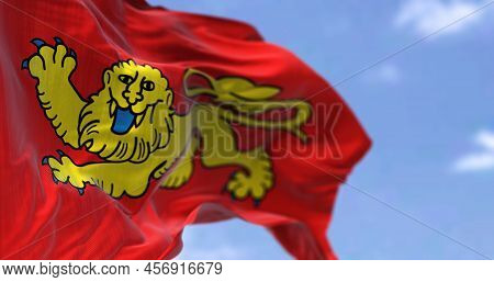 Rear View Of The Aquitaine Flag Waving In The Wind On A Clear Day. Aquitaine Is A Historical Region 