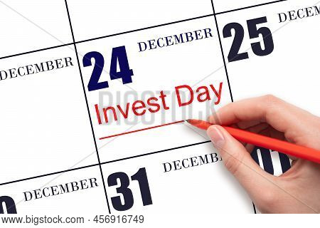 24th Day Of December. Hand Drawing Red Line And Writing The Text Invest Day On Calendar Date Decembe