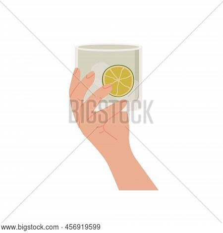 Female Or Male Hand Holding Rocks Glass With Classic Gin Tonic Cocktail. Old Fashioned Glass With Al