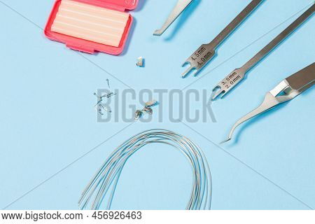 A Set Of Special Tools For An Orthodontist To Install Braces For A Patient. Orthodontic Arcs, Ligatu
