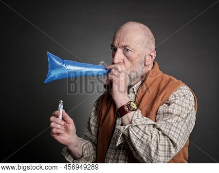 Head And Shoulders Portrait Of A Senior Man Performing Breath Test To Diagnose Sibo (small Intestina