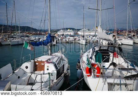 Marina With Sailing Boats In Porto Mirabello Port, La Spezia, Liguria, Italy. Yachts With Italian Fl