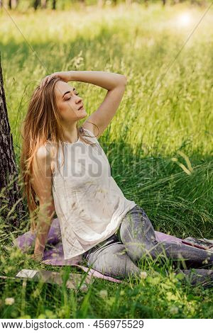Girl Is Sitting On Resting From Work. Freelance. Selfeducation. The Concept Of Remote Learning And O