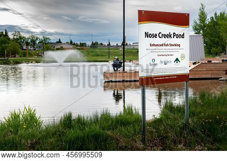 Airdrie Alberta Canada, June 12 2022: A Public Notice At A Stocked Rainbow Trout Pond At Nose Creek 