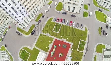 Parking with cars and playground in modern residential complex. View from unmanned quadrocopter. 