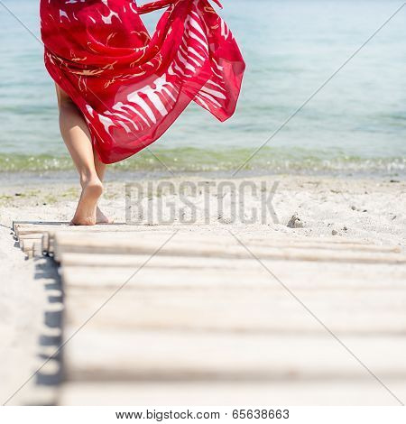 Woman walks at the beach