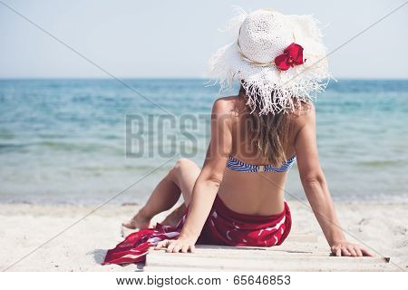 Woman sitting at the beach