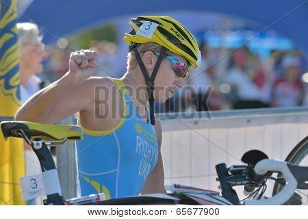 DNEPROPETROVSK, UKRAINE - MAY 24, 2014: Inna Ryzhykh of Ukraine in the transition area during ETU Sprint Triathlon European cup. It's the first time Triathlon European Cup take place in Ukraine