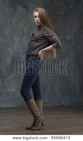 Woman standing on dark background
