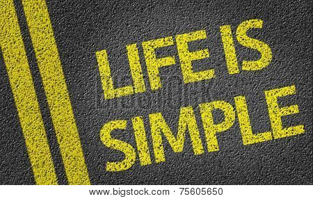 Life is Simple written on the road