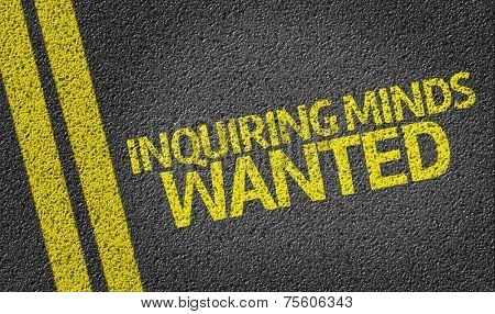 Inquiring Minds Wanted written on the road