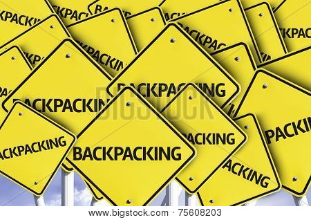 Backpacking written on multiple road sign 