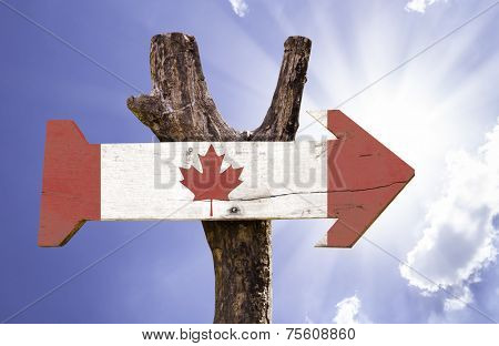 Canada wooden sign on a beautiful day