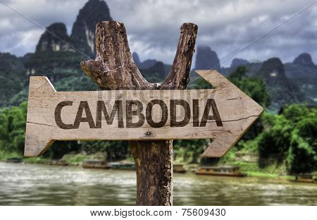 Cambodia wooden sign with a forest background