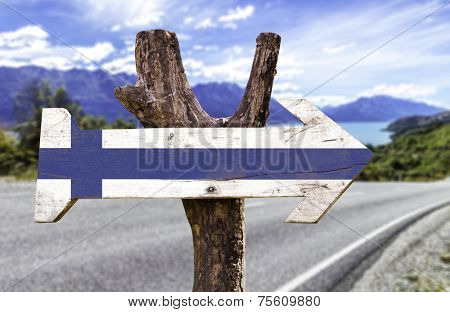 Finland wooden sign with a landscape background