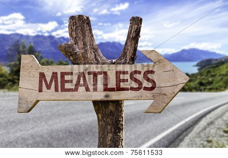 Meatless wooden sign with a street background 