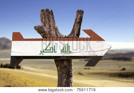 Iraq wooden sign with a desert background