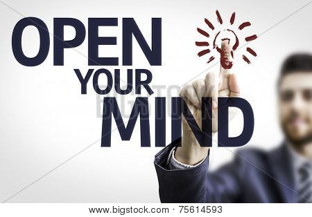 Business man pointing to transparent board with text: Open your Mind